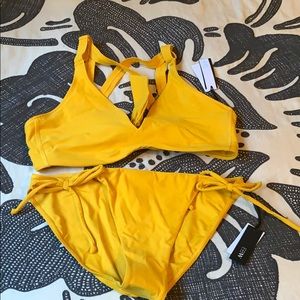 Yellow bathing suit top and bottoms
